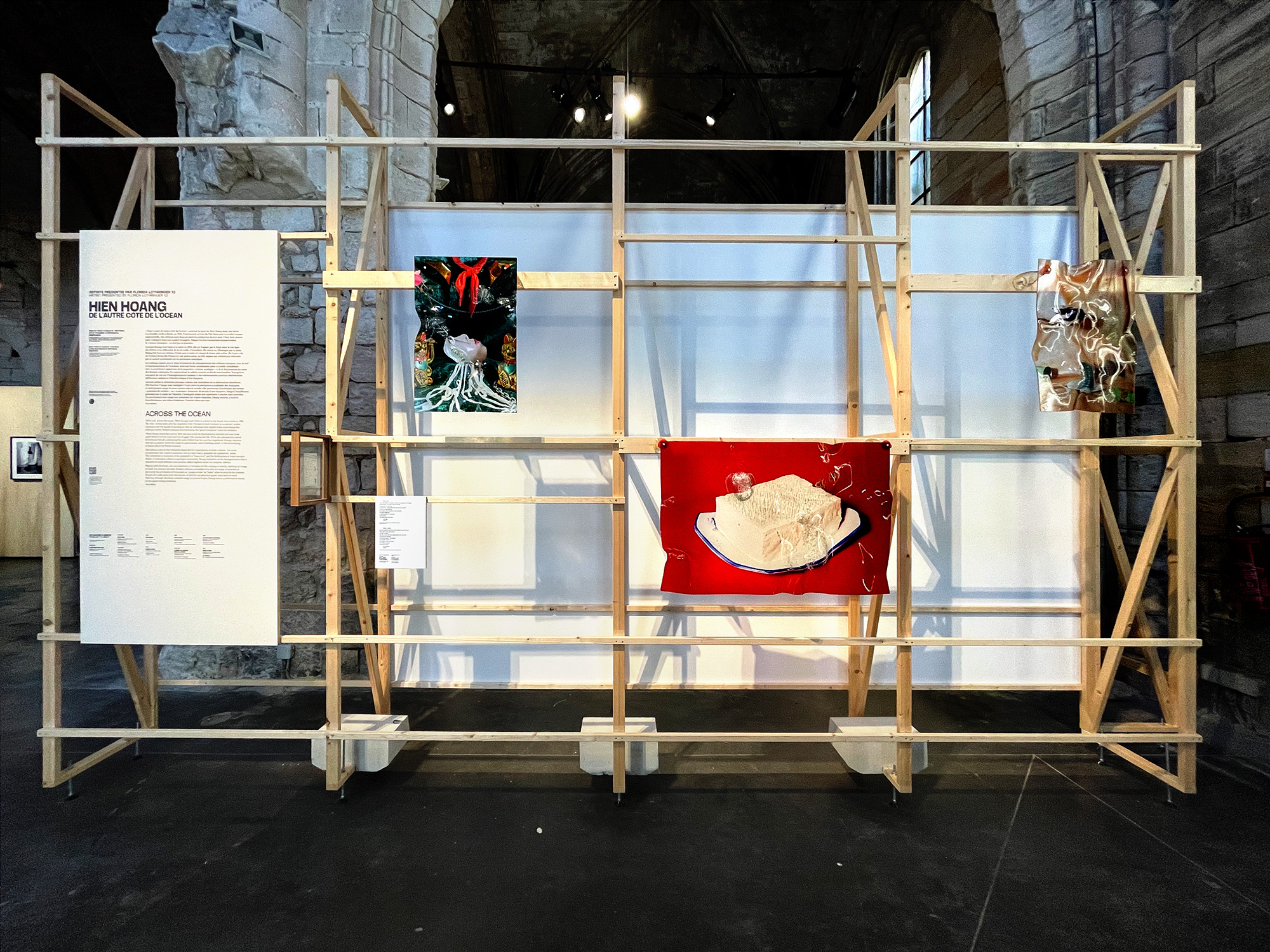 Hiền Hoàng. 2023. Multimedia installation: bended plexiglass sculptures, collected postcard, printed silk, performance video. Installation view , in the "Moving Definition", Louise Roederer Discovery Award, Rencontres de la Photographie d'Arles, 2023, Arles, France.